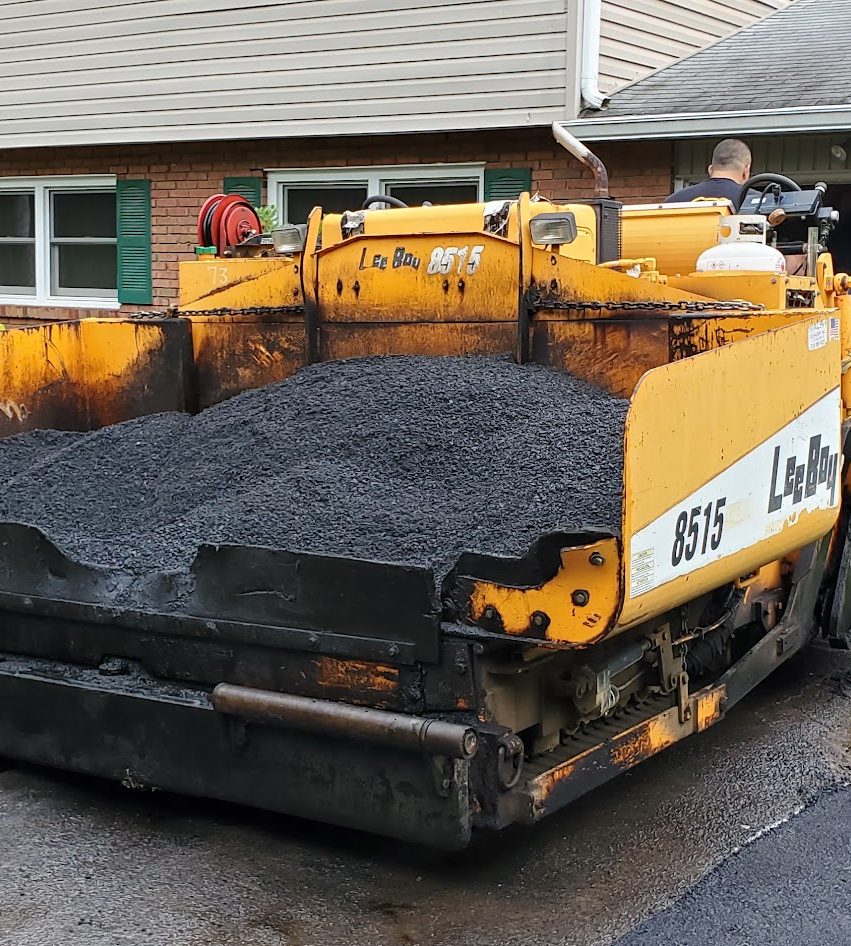 Asphalt paver laying a residential driveway in Mercer County, NJ