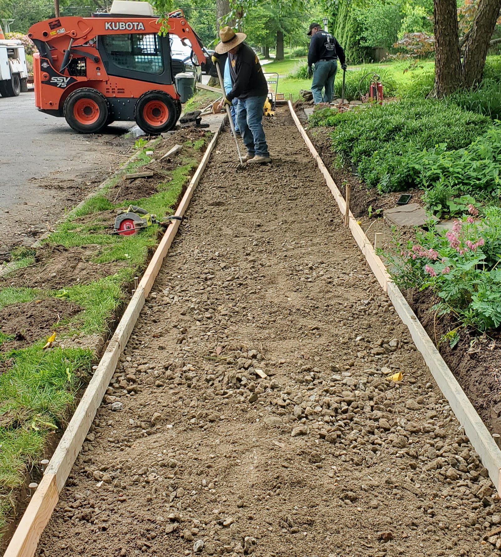 Graded base prepared for proper water runoff before paving