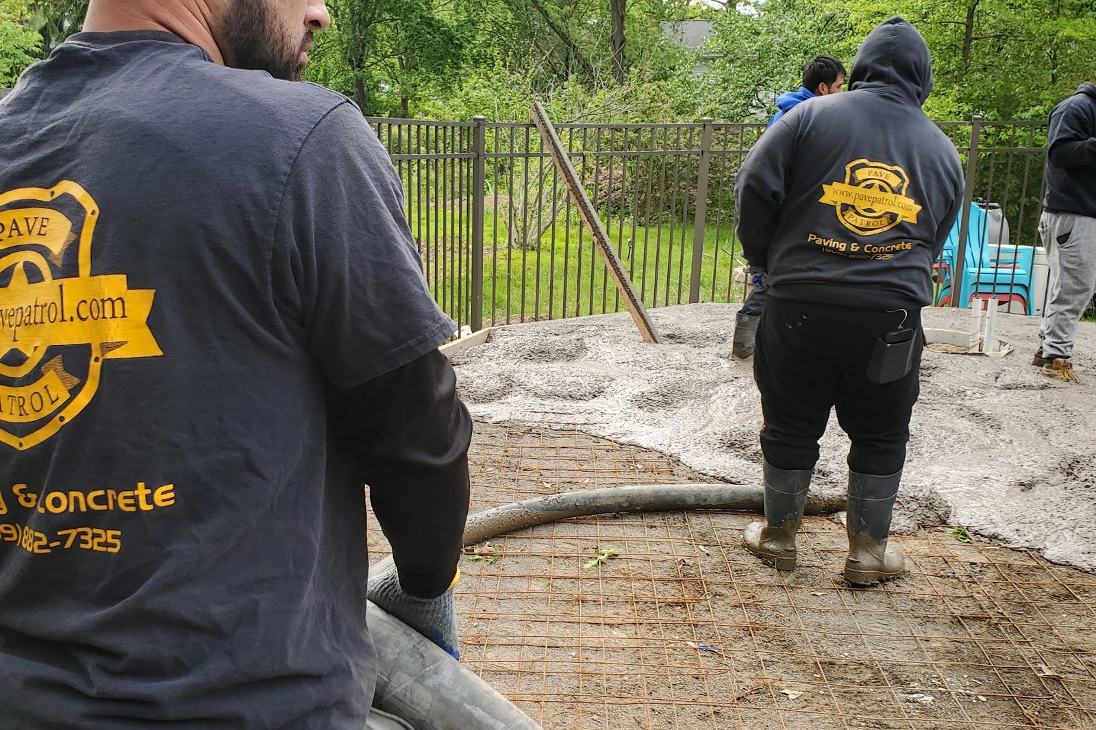 Pave Patrol crew placing concrete for a patio in Mercer County, NJ